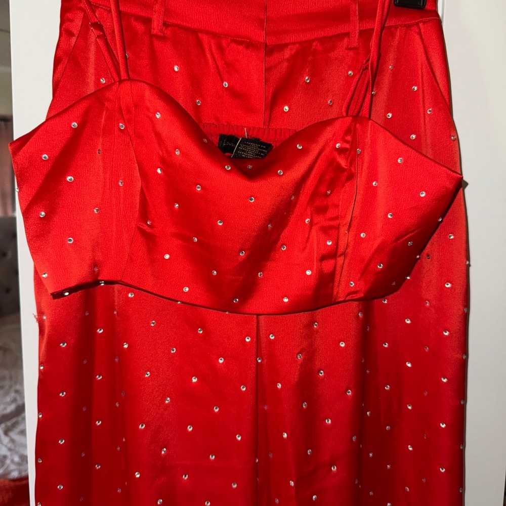 Elegant Rhinestone-embellished satin pants and top. Bright red color.